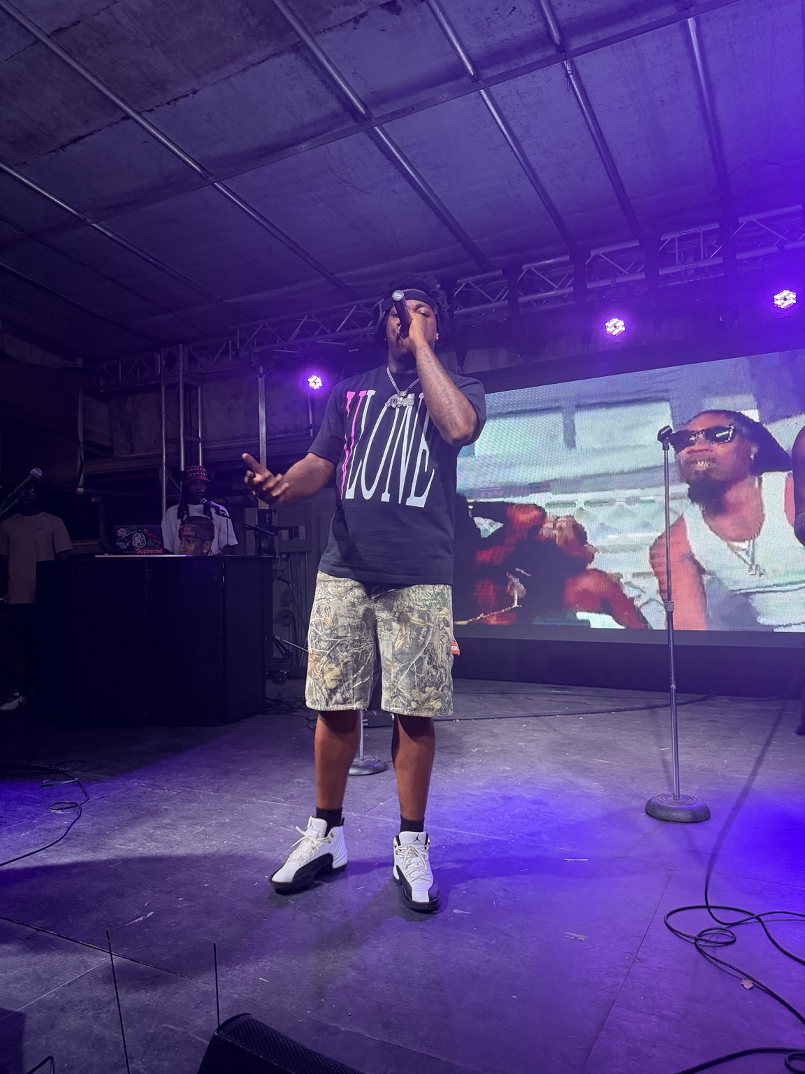 A performer addresses the crowd from the Heartwood Soundstage during the #iDoit4mycity Festival.