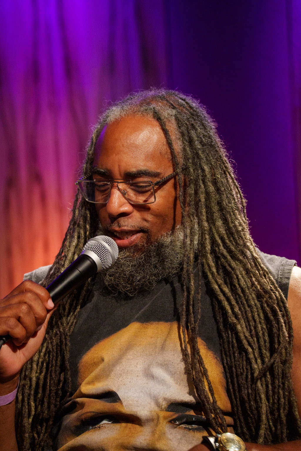 TJ Chapman speaks into a microphone during the #iDoit4mycity Masterclass.